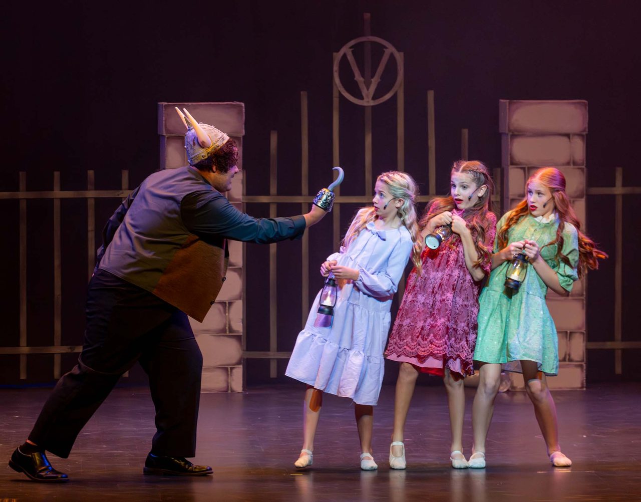 Aspire performers in a dramatic Villains Night scene