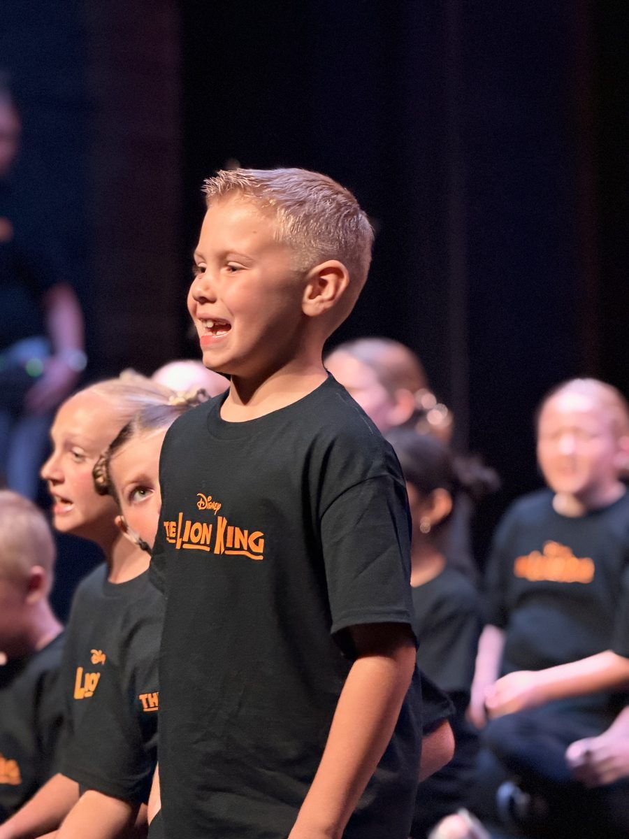 A Young Artist singing during the Lion King Kids Camp performance