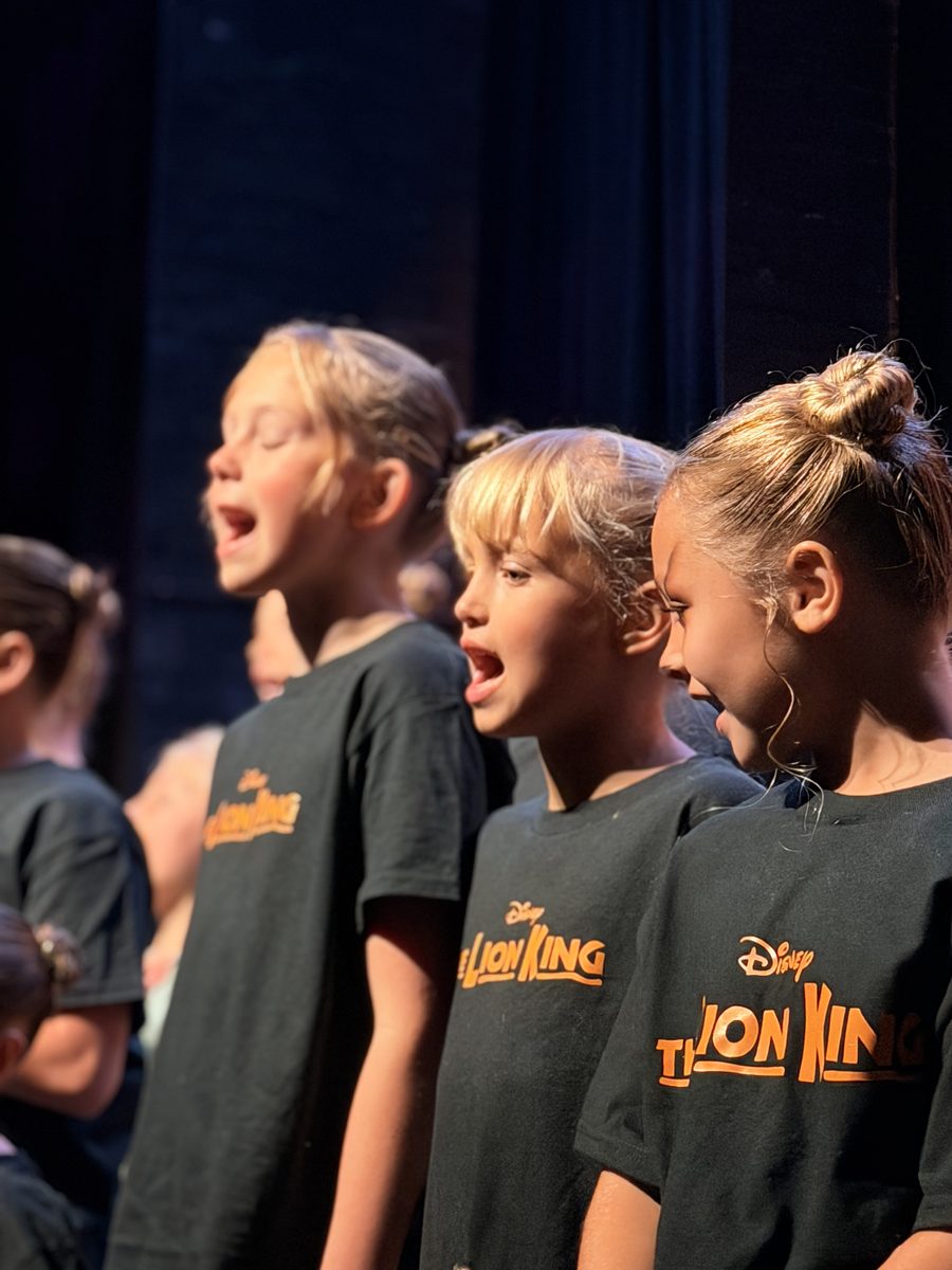 Young Artists singing together in profile
