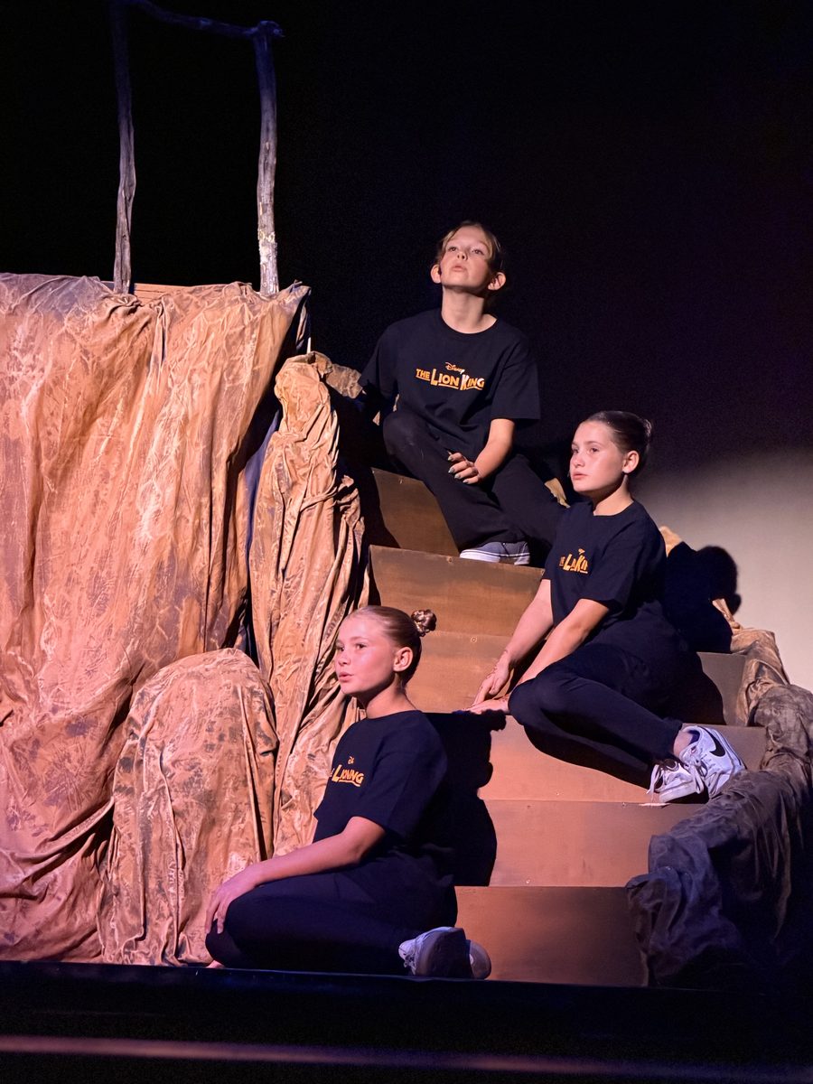 Young Artists performing on the set steps