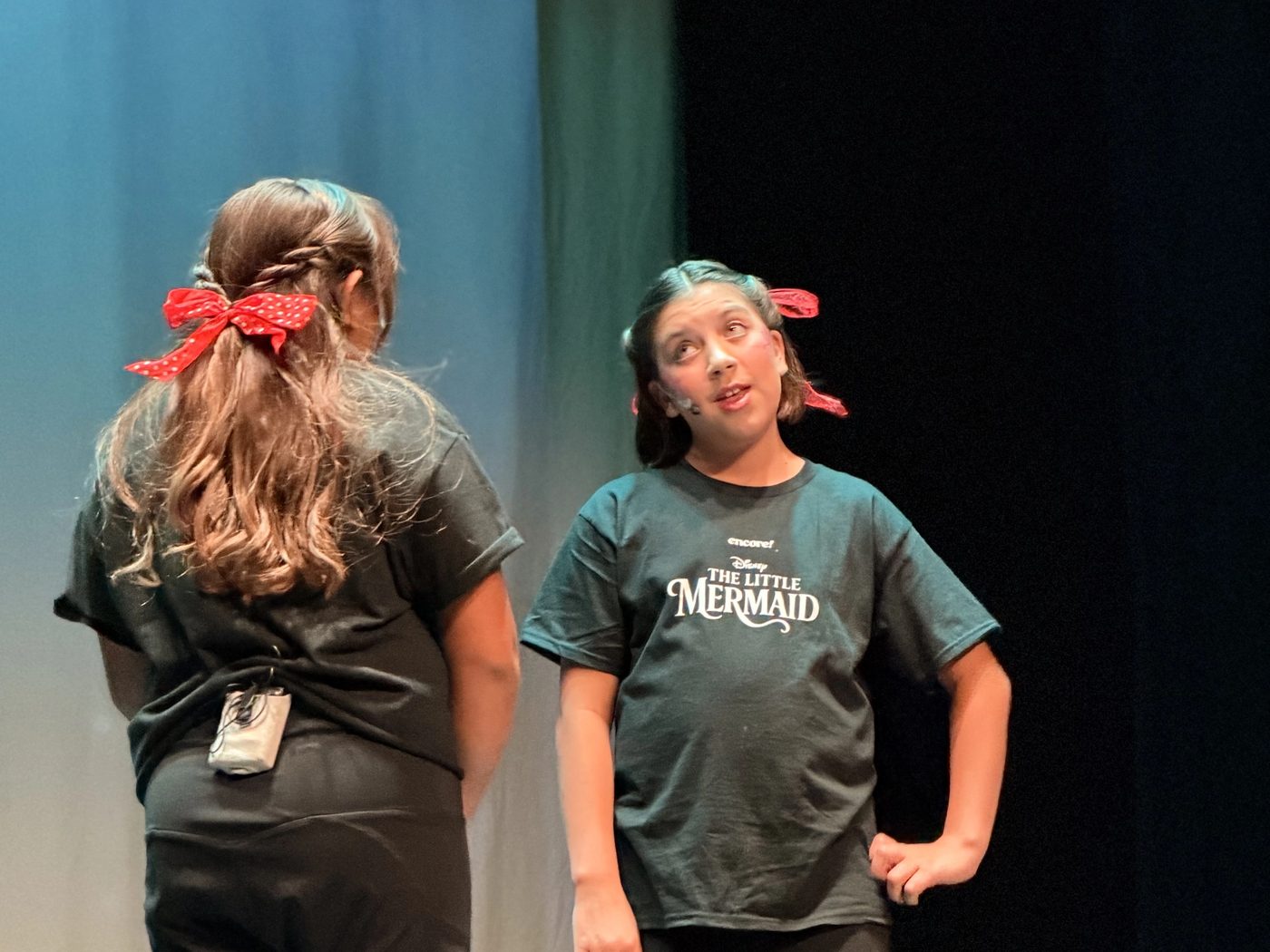 Two Young Artists performing a scene on stage