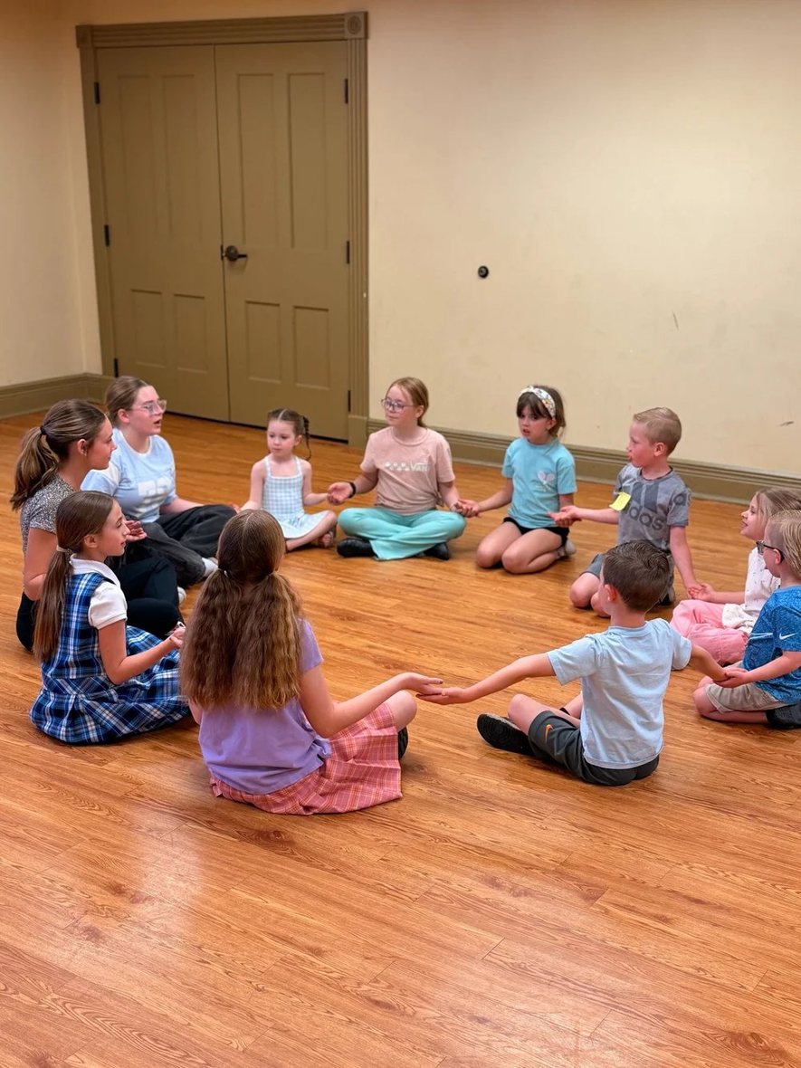 Young Artists in a warm-up circle on the first day of camp