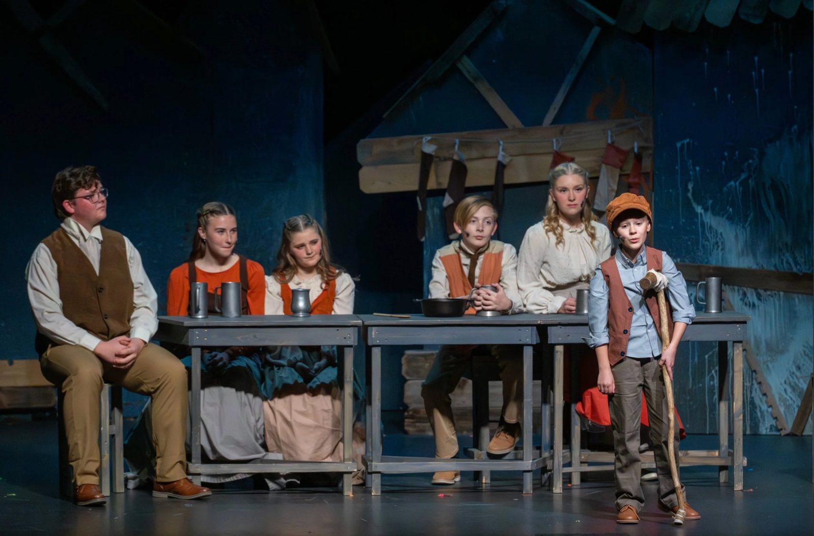 Encore cast around the table in A Christmas Carol