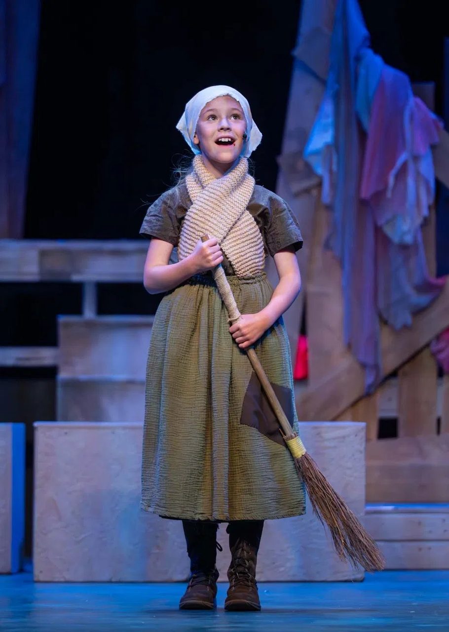 A young performer in costume in Encore's production of Les Misérables